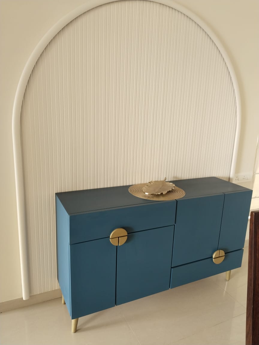 Blue sideboard under arched wall