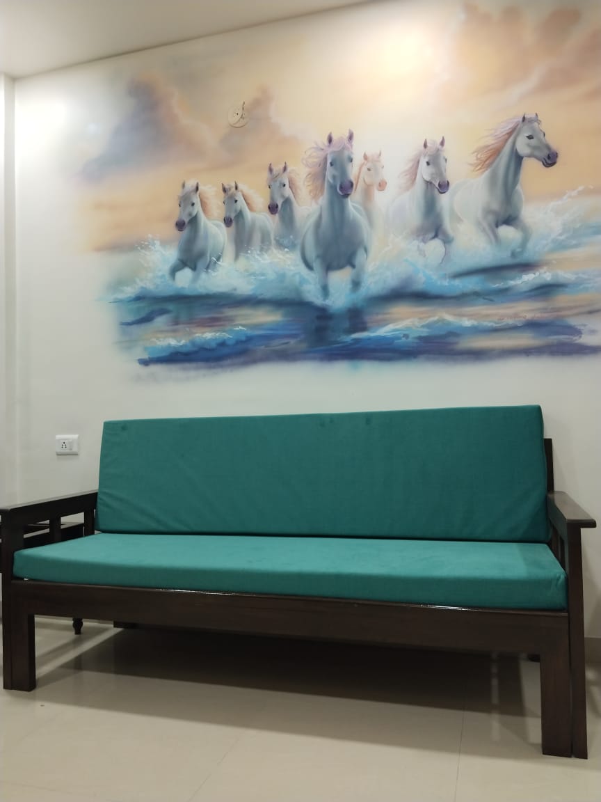 Sofa seating with mural backdrop