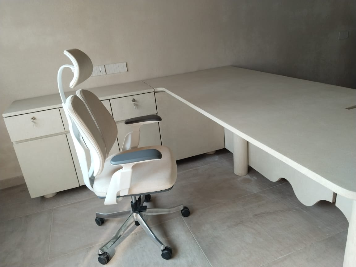White L-shaped desk with chair